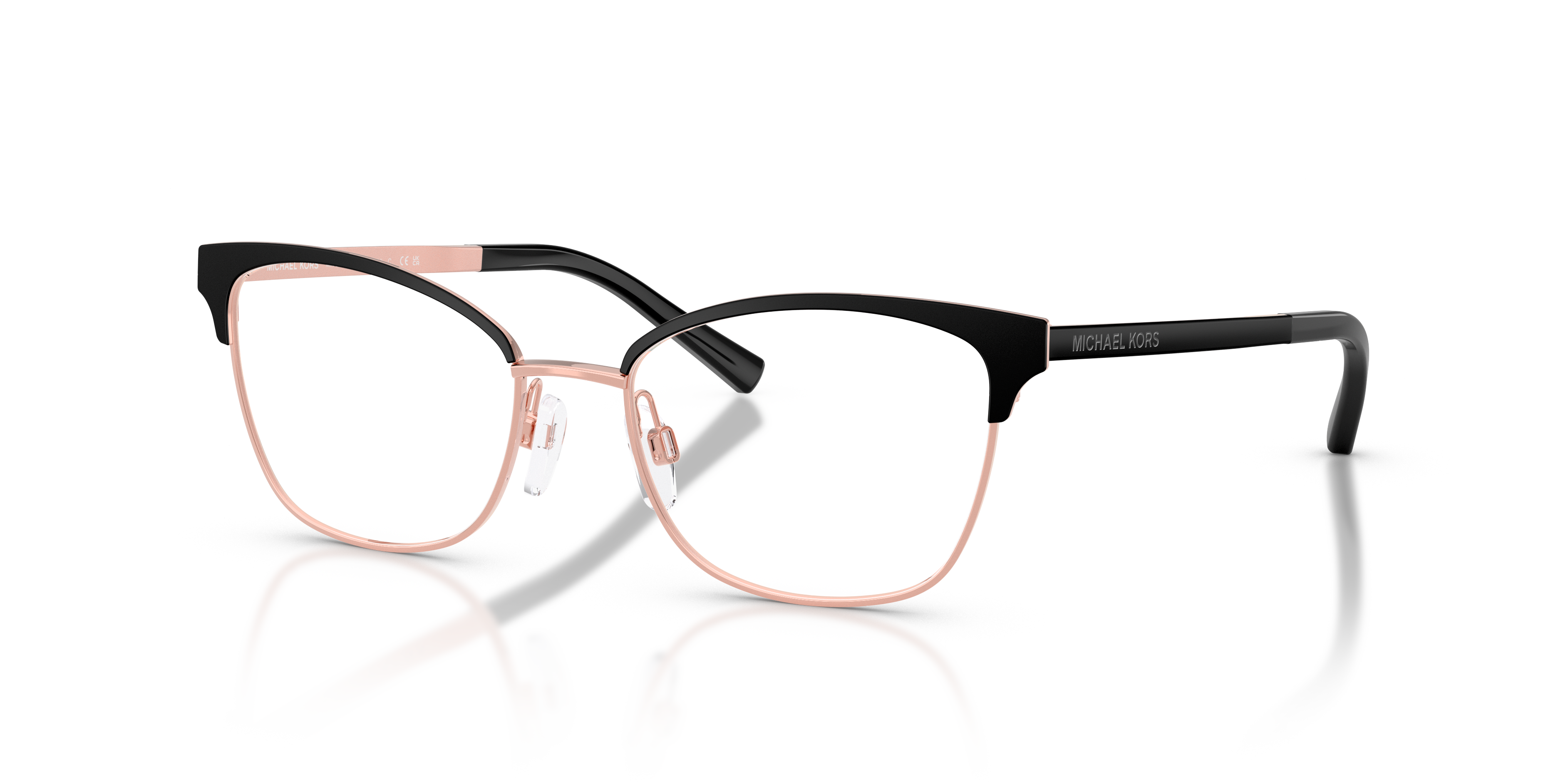 Donna con occhiali da sole Michael Kors Adrianna IV neri opachi con aste oro rosa, in primo piano un modello 0MK3012.