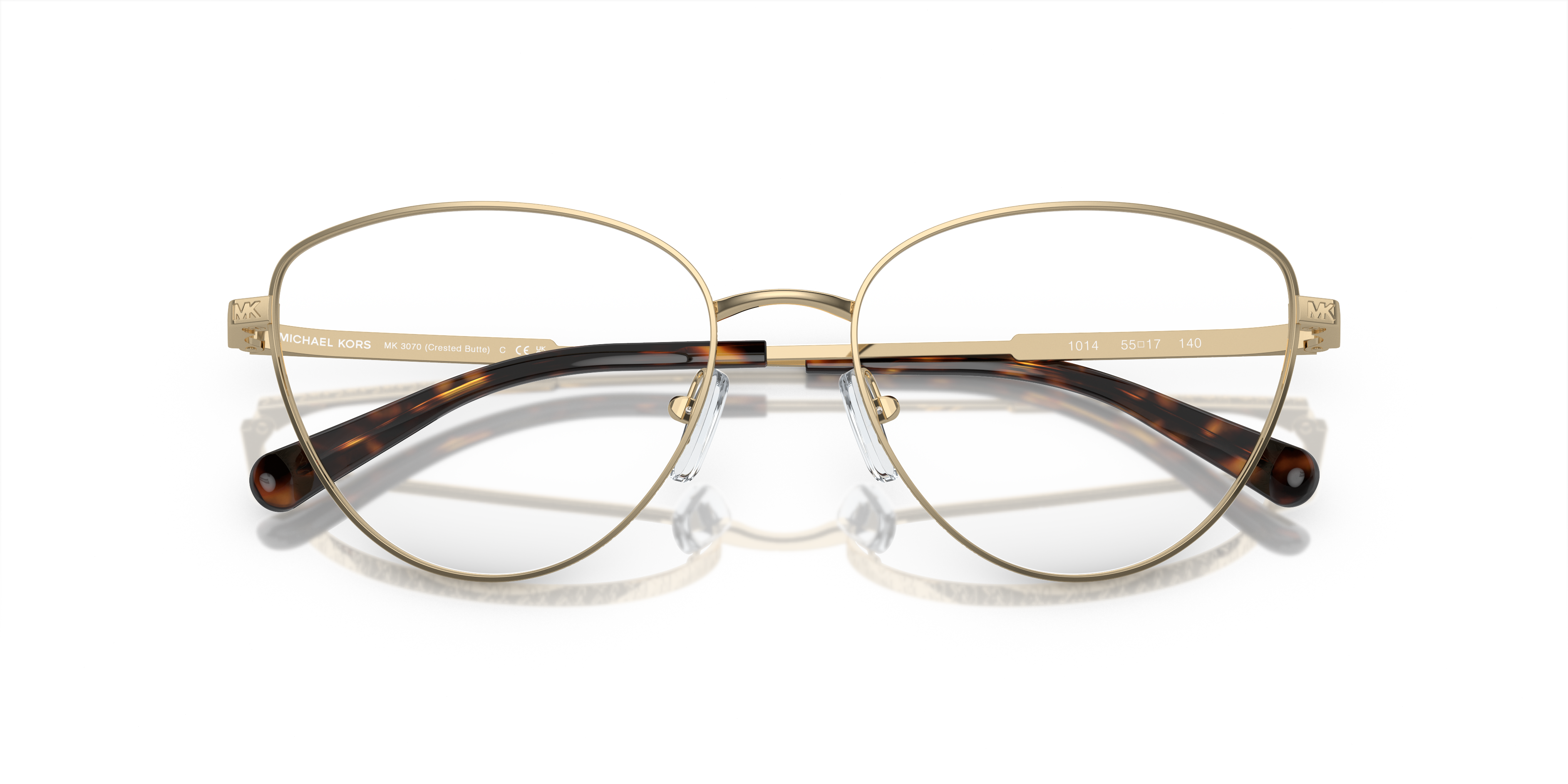 Occhiali da sole Michael Kors donna 0MK3070 CRESTED BUTTE con montatura Rose Gold e lenti grigie sfumate, appoggiati su una s