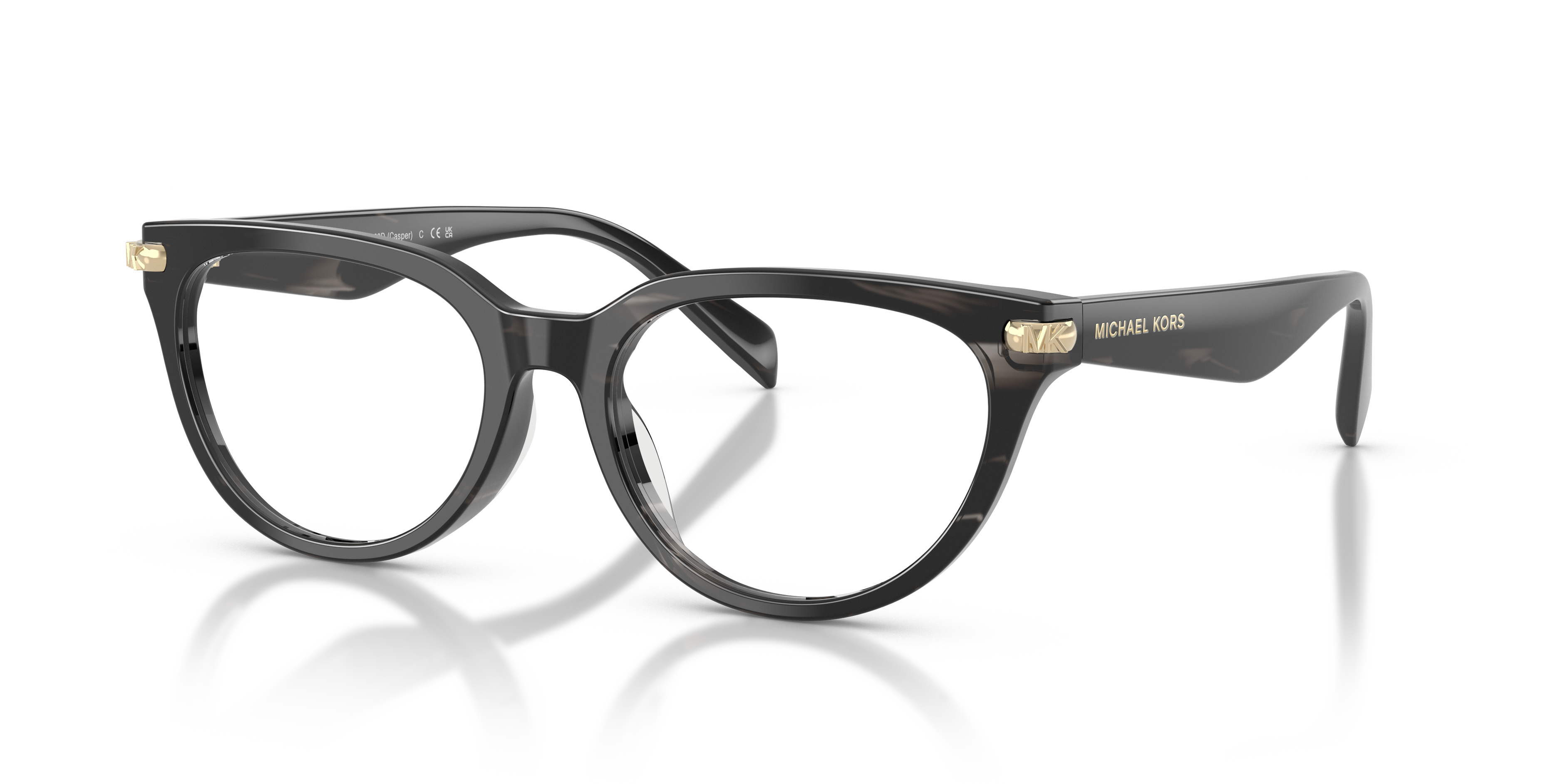 Occhiali da sole Michael Kors Casper 0MK4168D Black Horn per donna, indossati da una modella con sfondo neutro.