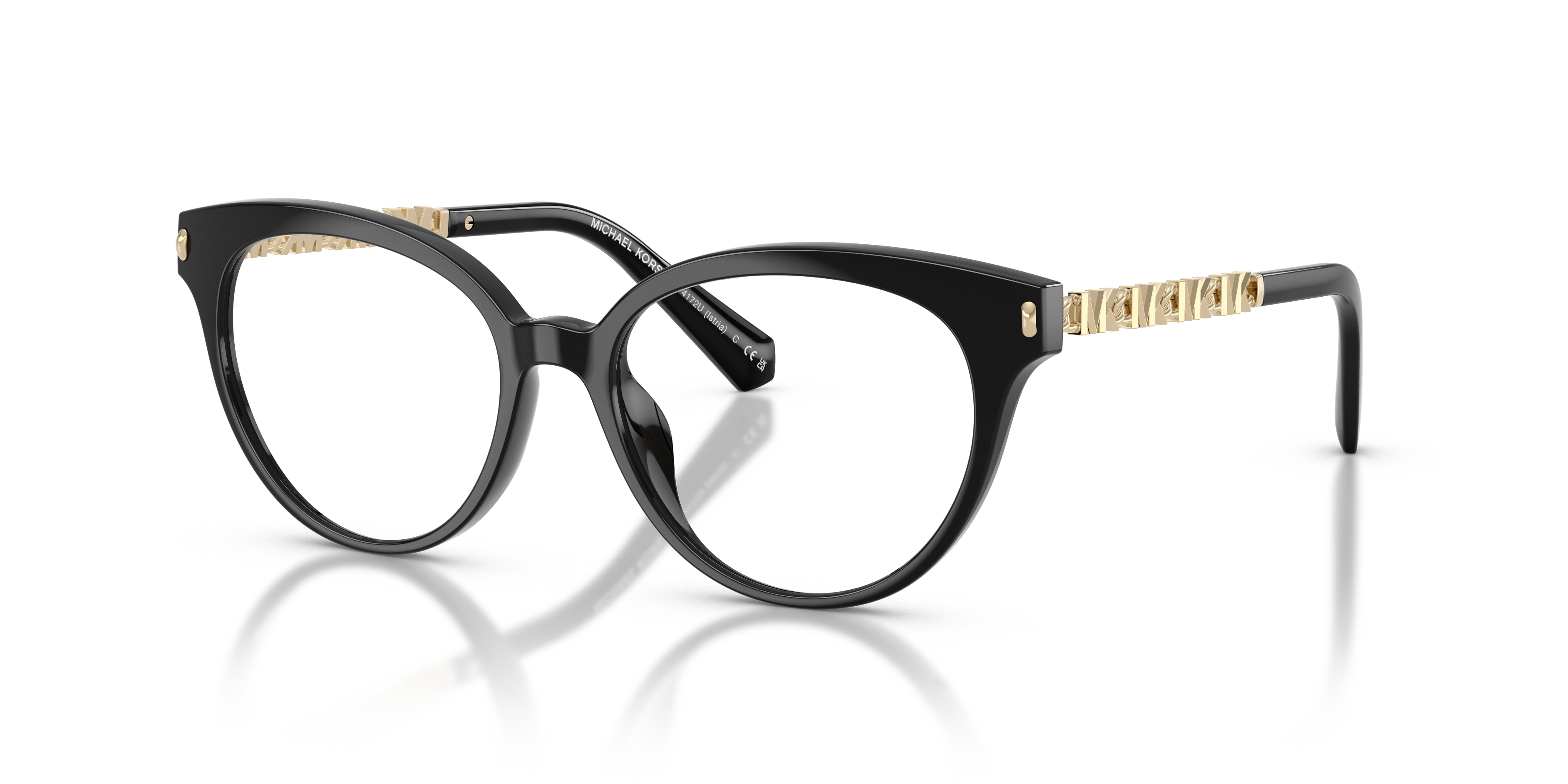 Occhiali da sole Michael Kors Istria neri, modello 0MK4172U, indossati da una donna elegante che guarda leggermente di lato.