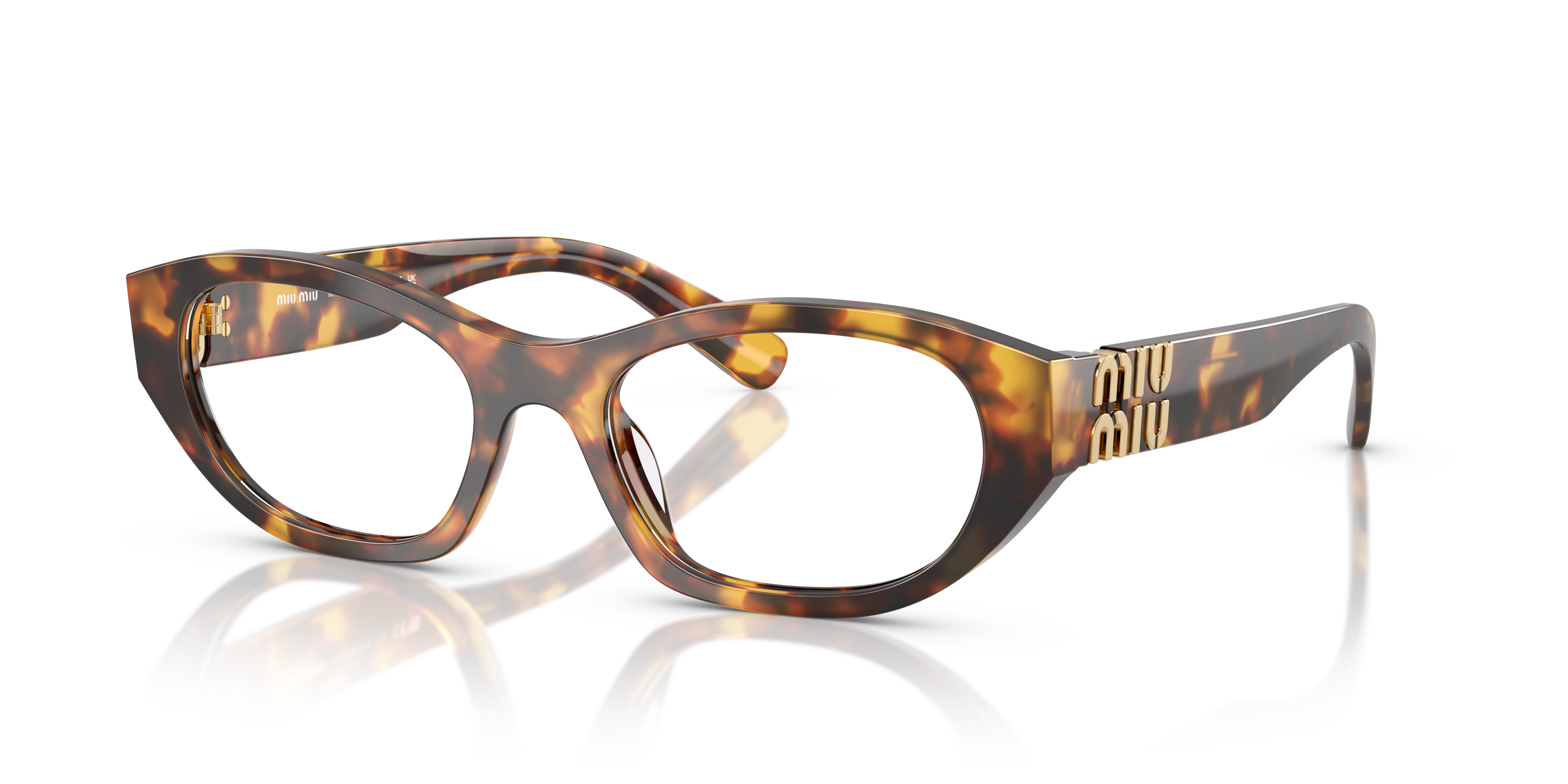 Occhiali da sole Miu Miu donna MU 03WV Havana Honey con montatura cat-eye, lenti scure, indossati su sfondo neutro.