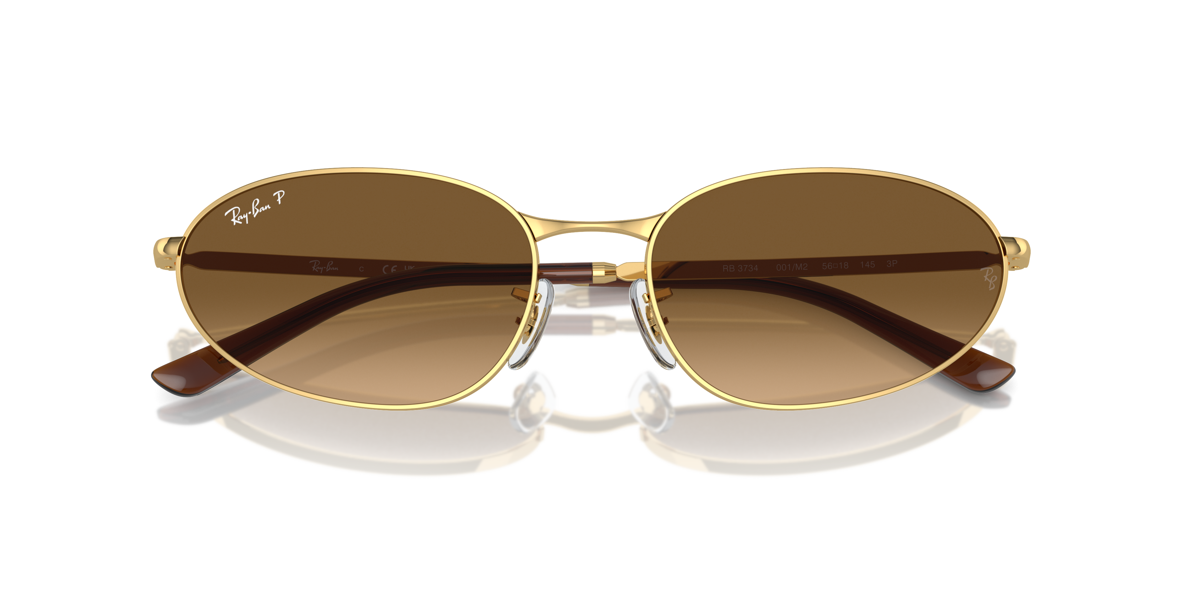 Occhiali da sole Ray-Ban RB3734 Arista Gold con montatura dorata lucida, indossati da una persona per mostrare lo stile unise