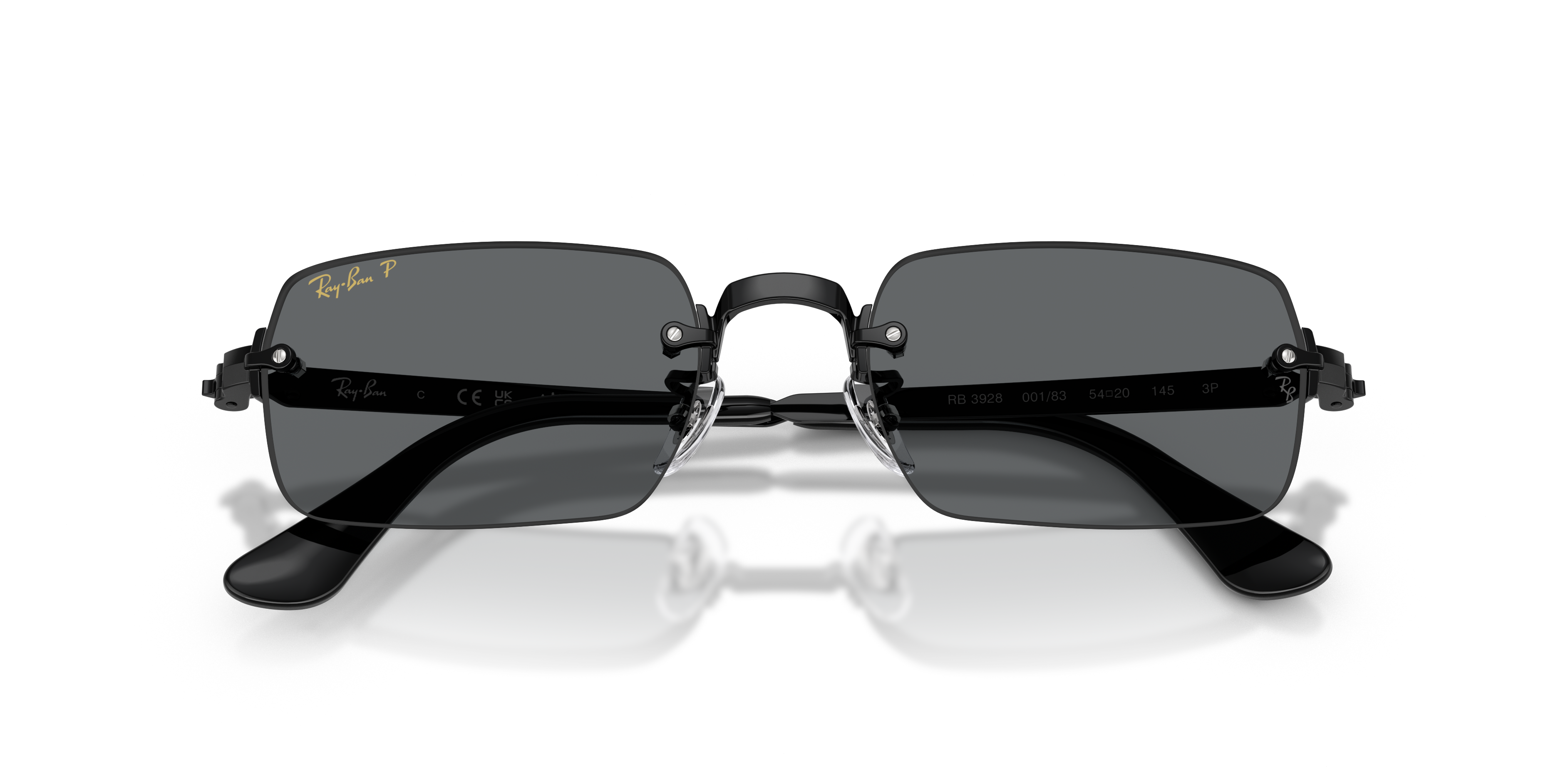 Occhiali da sole Ray-Ban RB3928 Arista Gold visti di fronte su sfondo chiaro, che evidenzia la montatura geometrica metallica