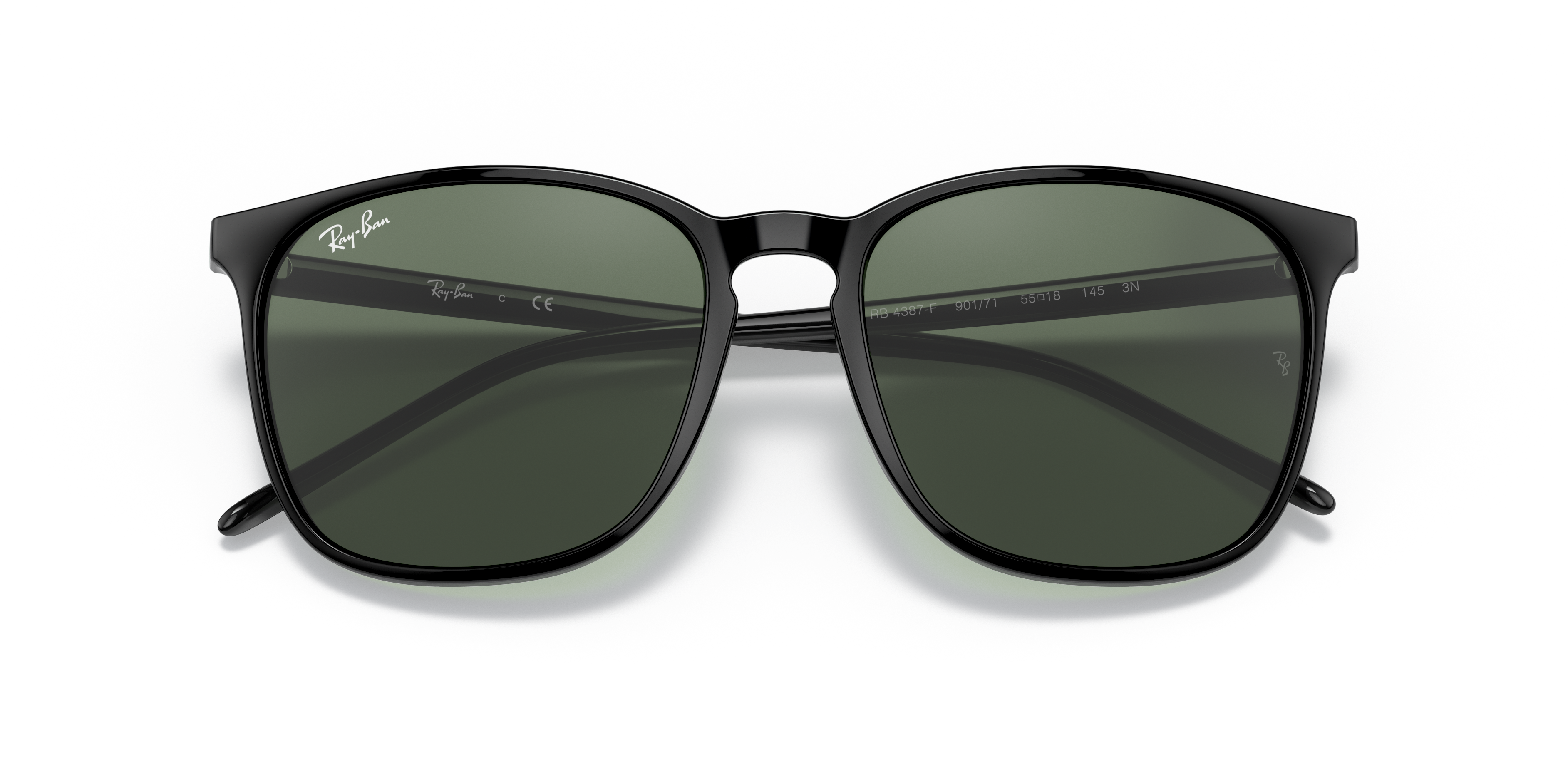 Occhiali da sole Ray-Ban RB4387F Tartaruga posati su una superficie chiara, che mostra la montatura in propionato e le lenti