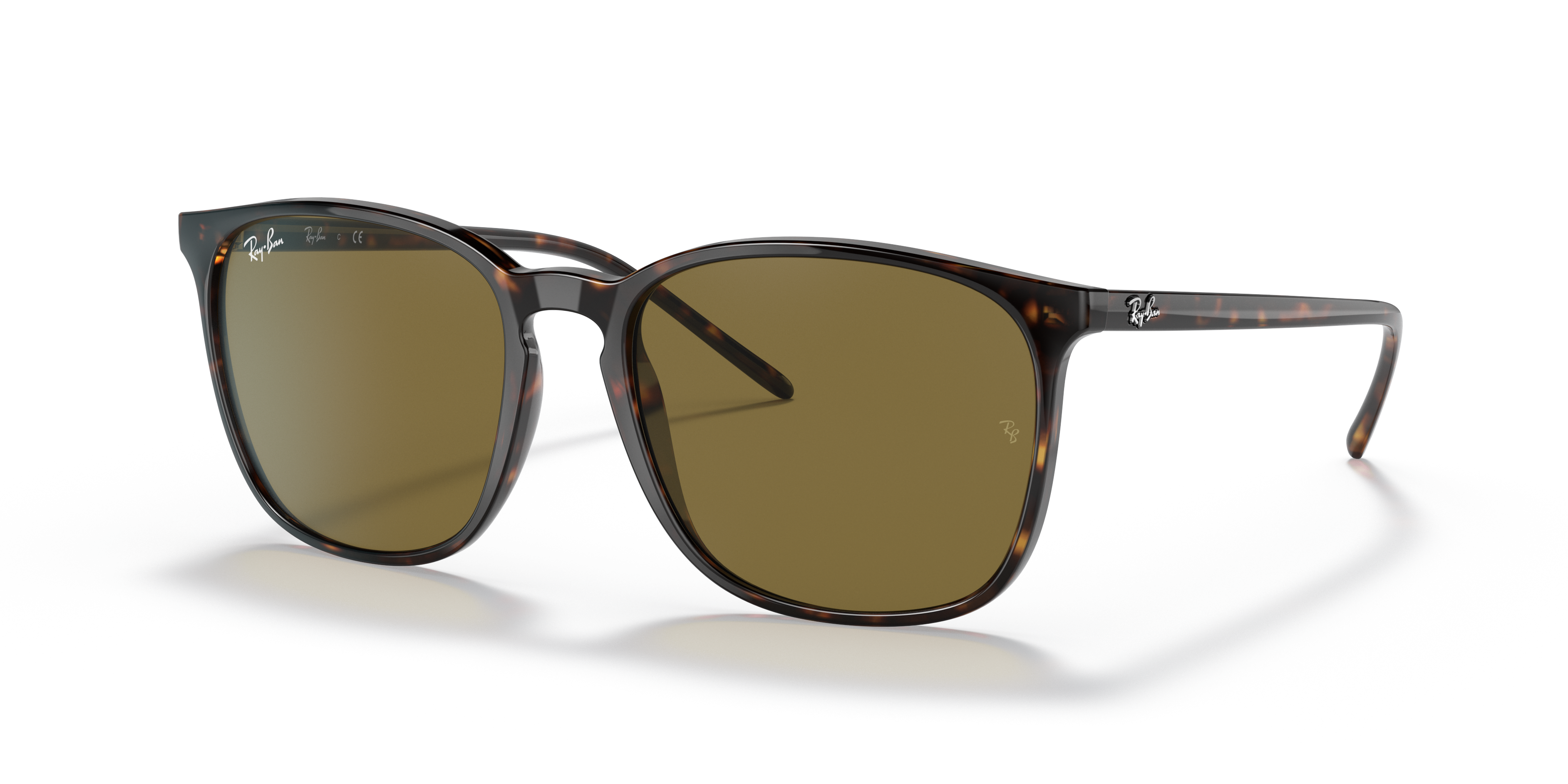 Occhiali da sole Ray-Ban RB4387F Tartaruga posati su una superficie chiara, che mostra la montatura in propionato e le lenti
