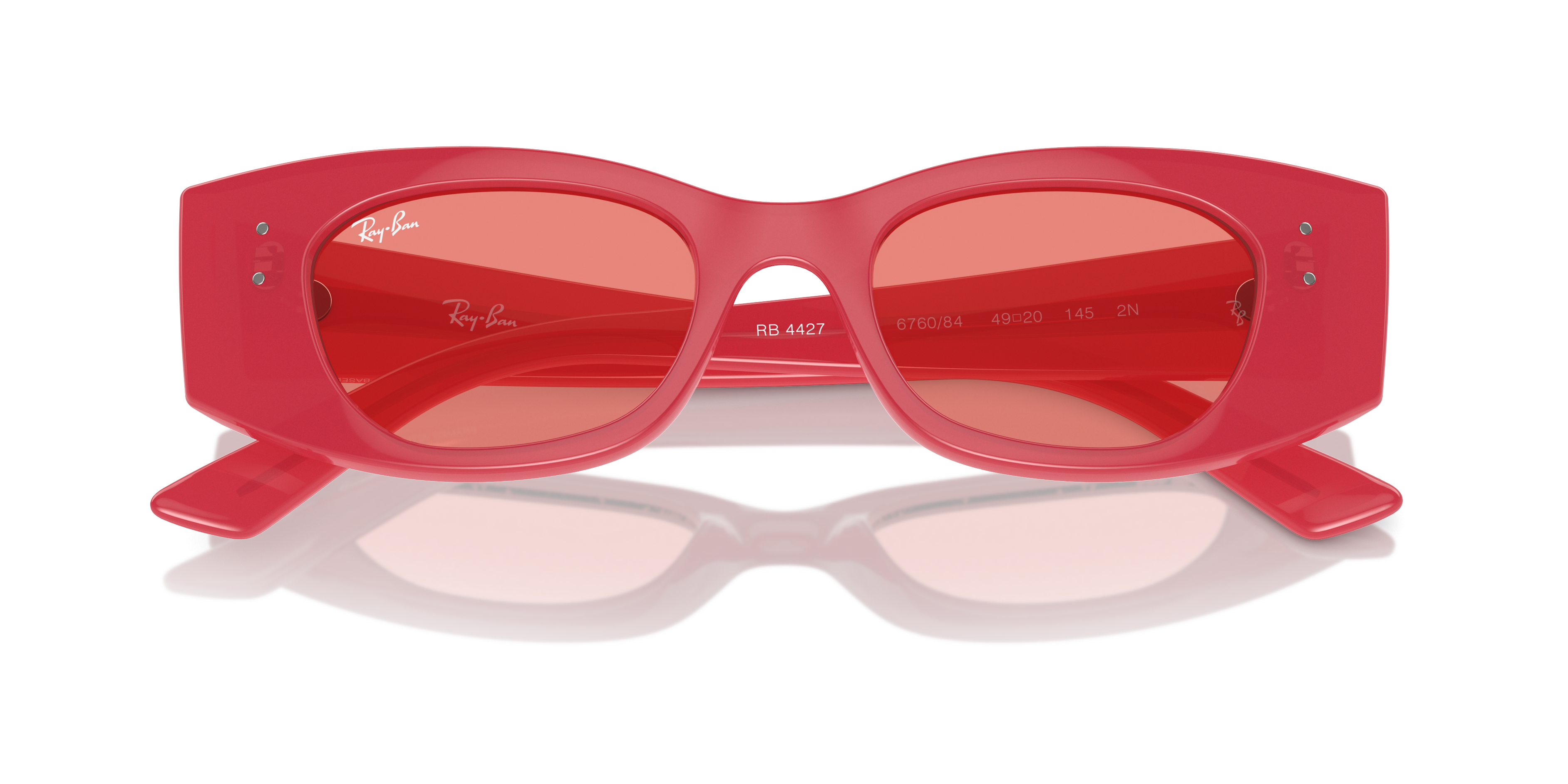 Occhiali da sole Ray-Ban 0RB4427 KAT unisex, montatura lilla e lenti grigie sfumate, posati su una superficie chiara