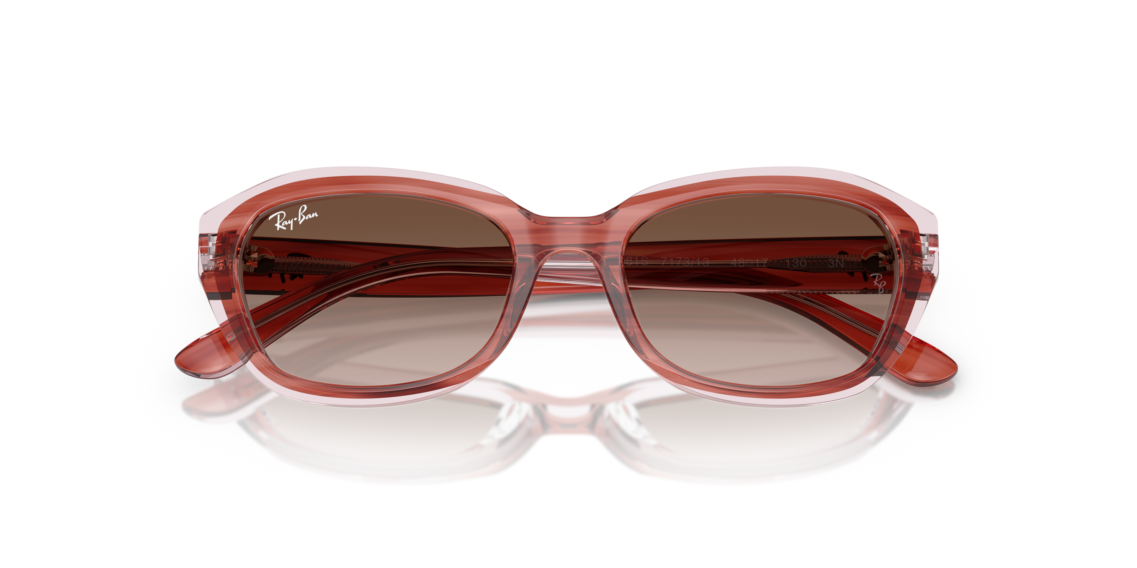 Occhiali da sole Ray-Ban modello RB9081S con montatura a strisce viola trasparenti, visti di fronte, su sfondo bianco