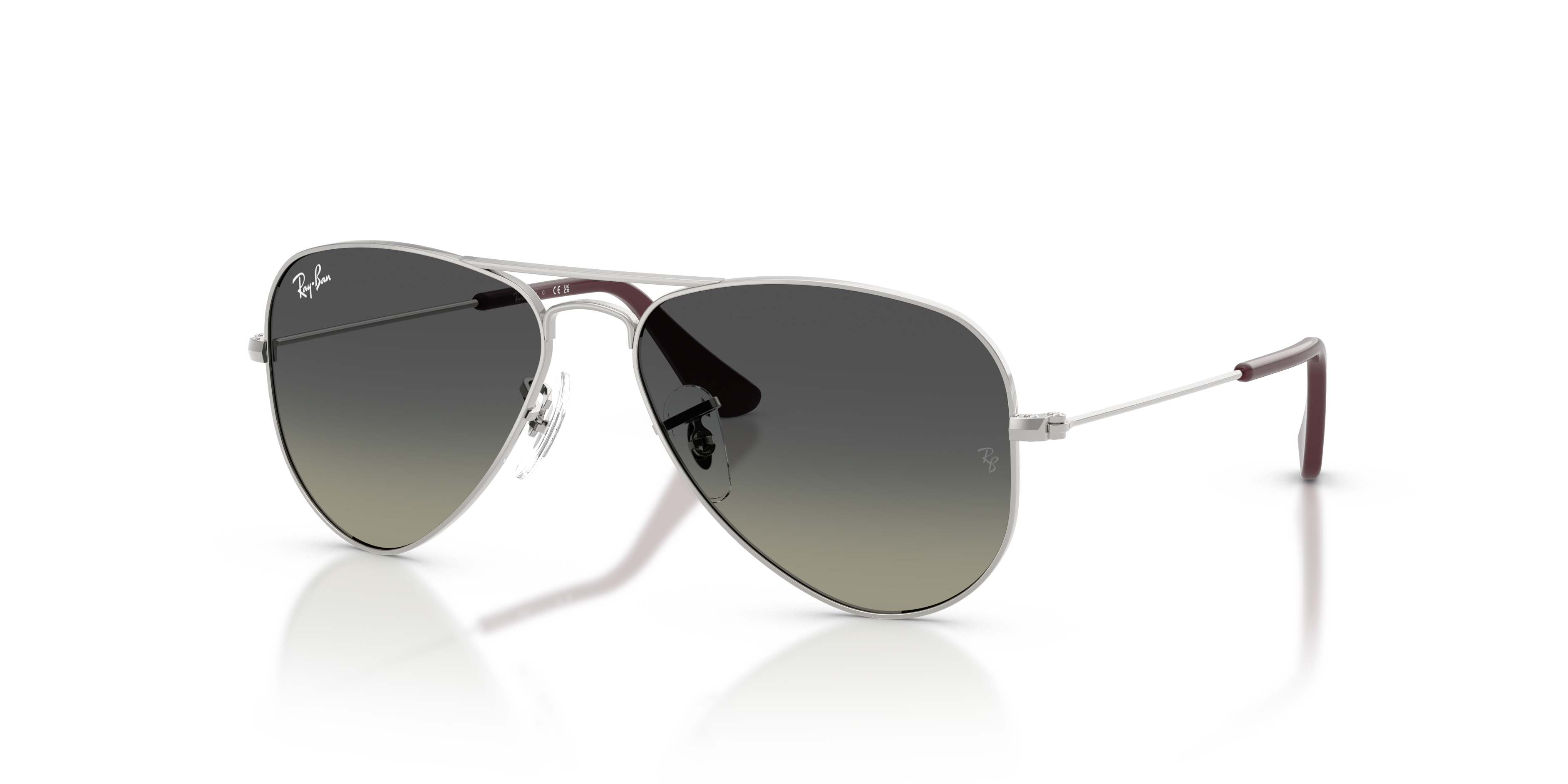 Occhiali da sole Ray-Ban Junior Aviator colore argento, modello 0RJ9506S, con montatura in metallo e lenti scure.