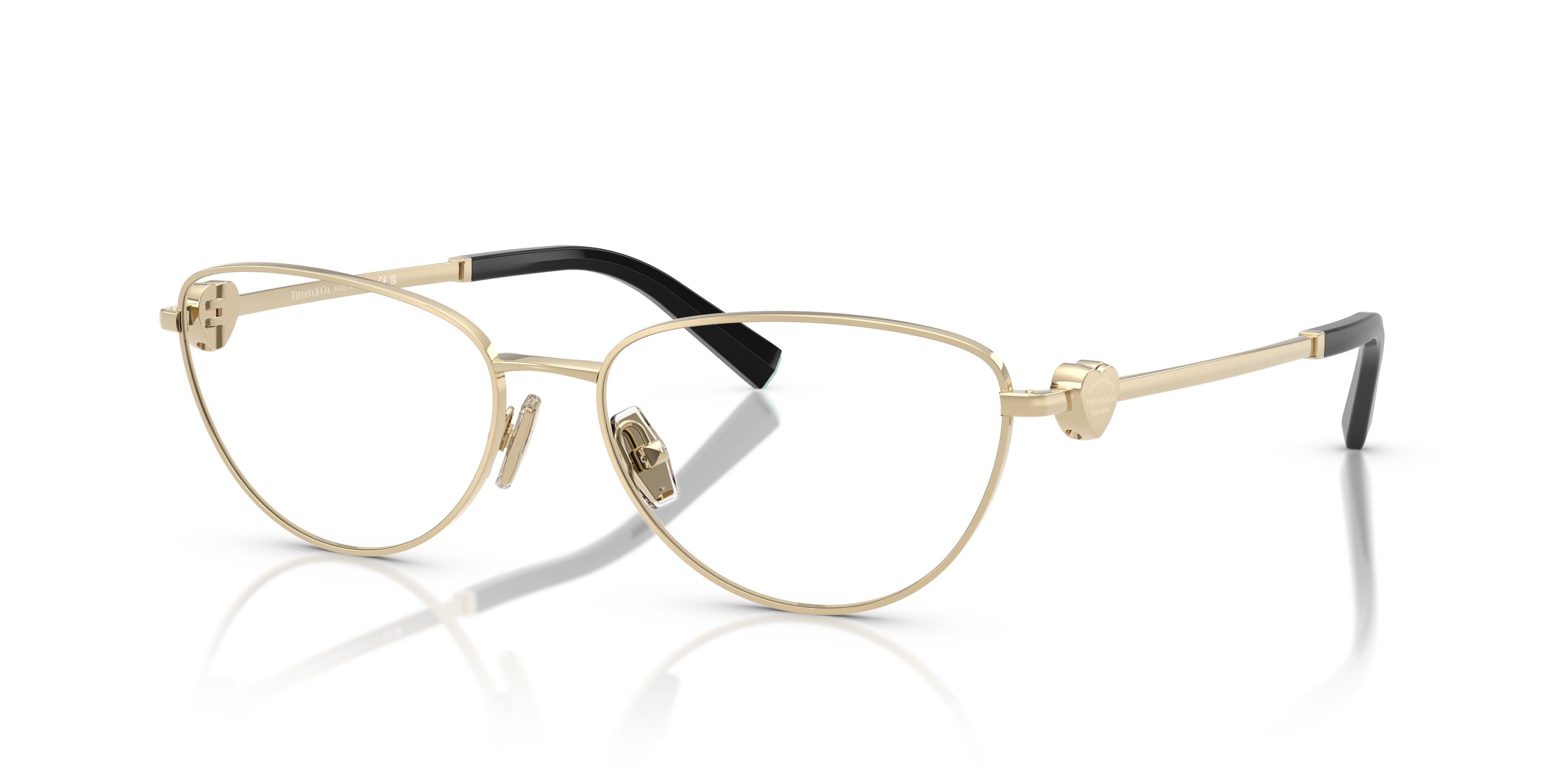 Occhiali da sole Tiffany TF1164B Pale Gold da donna, con montatura in metallo dorato e lenti sfumate, su sfondo neutro.