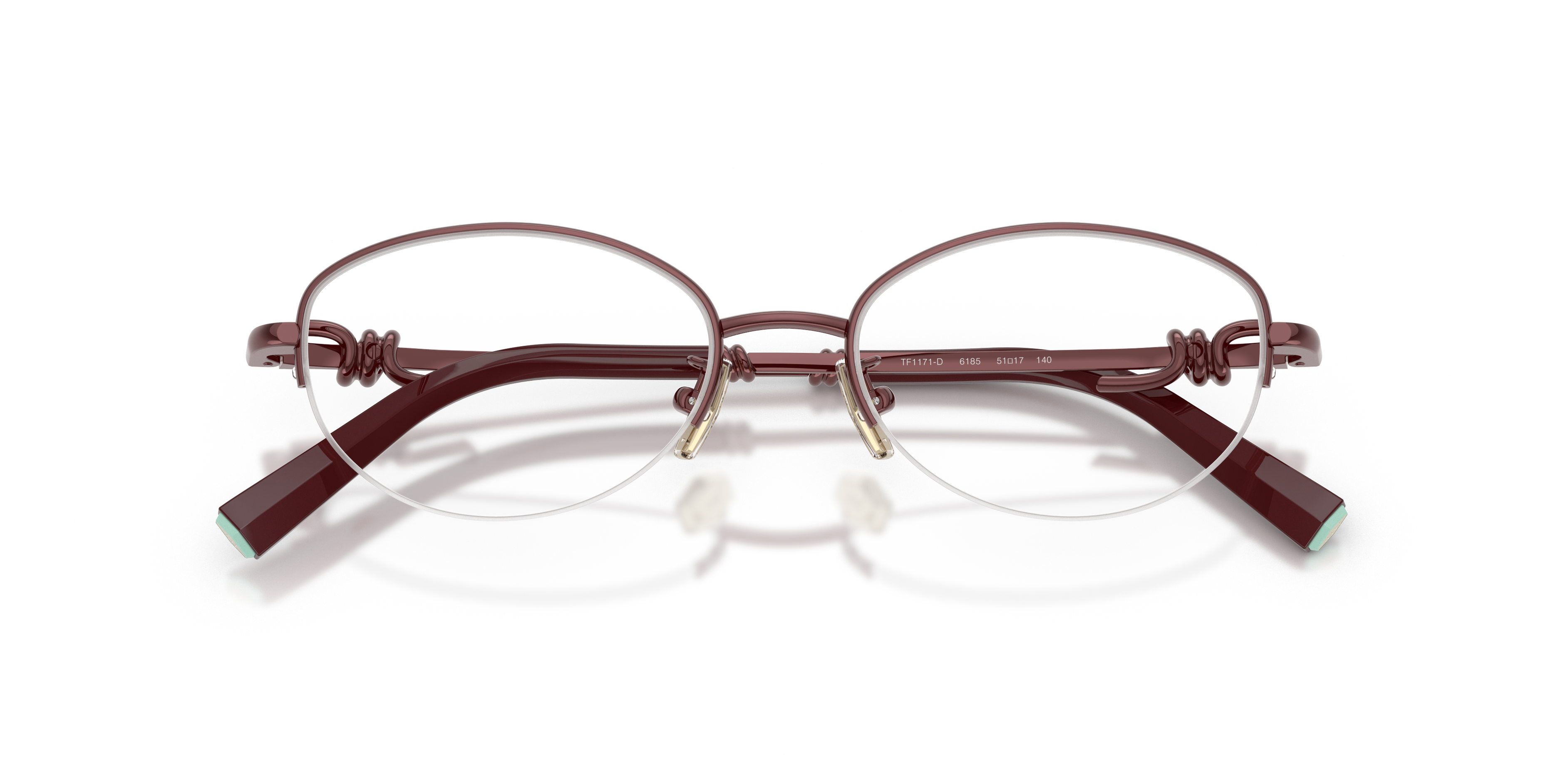 Occhiali da sole Tiffany TF1171D in metallo oro rosa con lenti sfumate su sfondo neutro, con dettagli del logo inciso sull'as