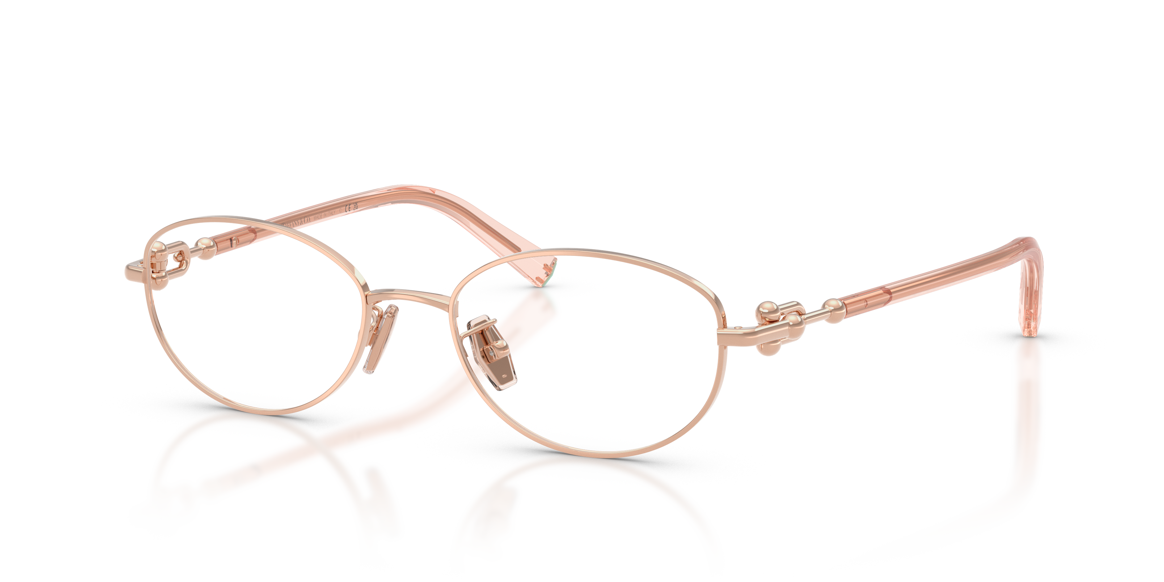 Occhiali da sole Tiffany & Co. modello TF1176D in metallo oro rosa con lenti scure, appoggiati su una superficie chiara