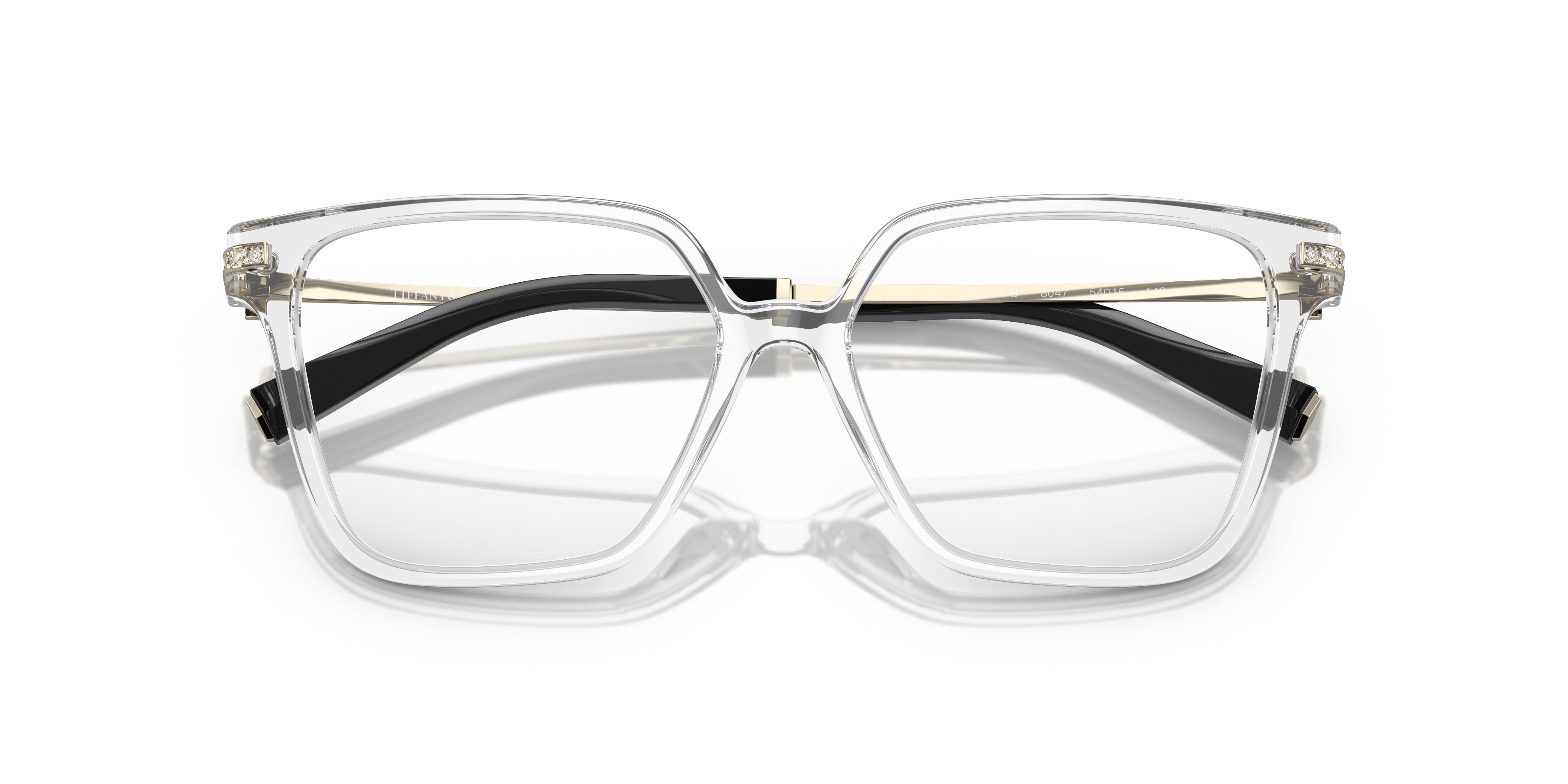 Occhiali da sole Tiffany & Co. modello 0TF2234B neri da donna, appoggiati su una superficie chiara, con lenti scure e aste lu