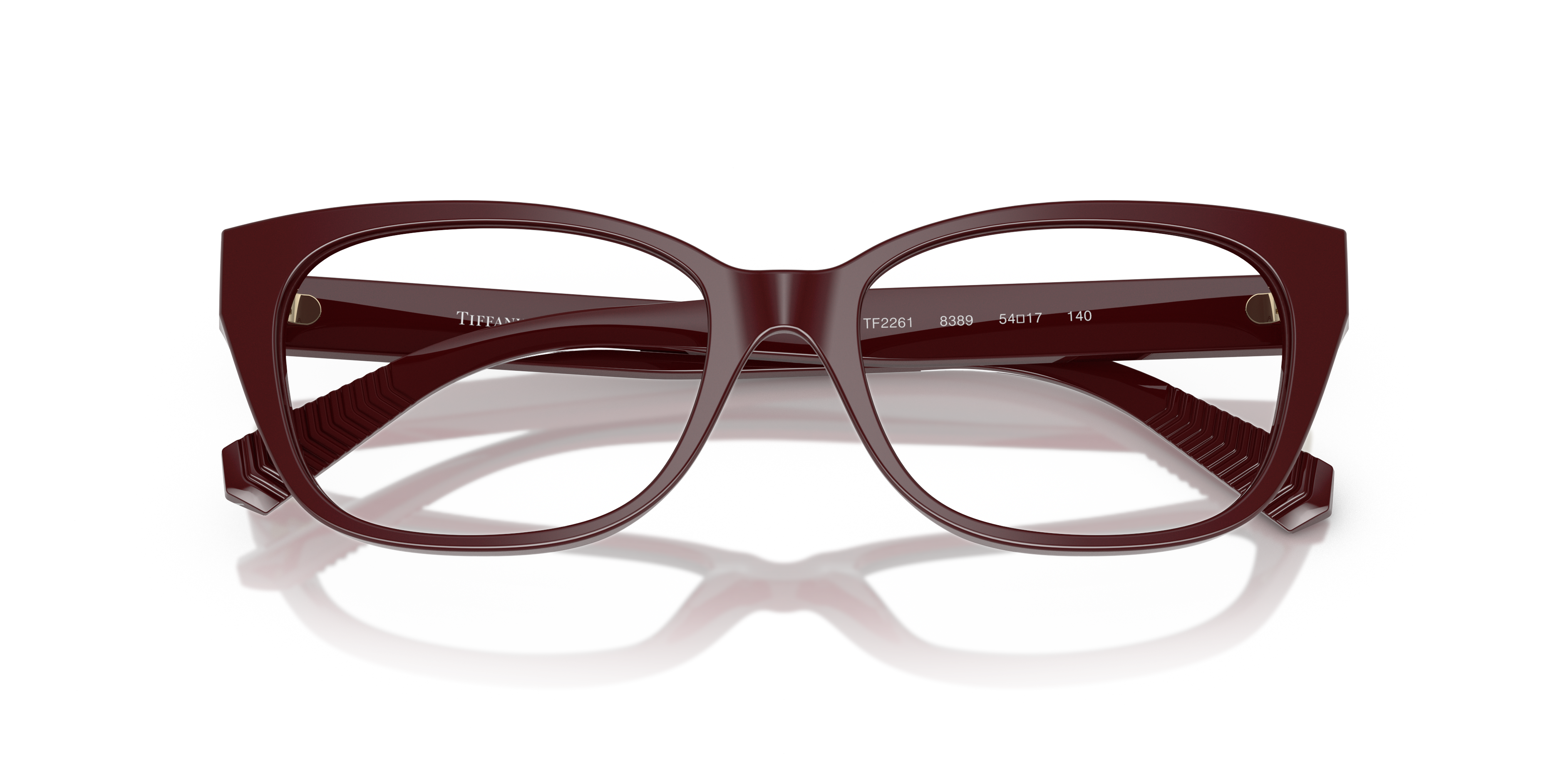 Occhiali da sole Tiffany TF2261 Havana Tiffany Blue indossati da una donna elegante, mostrano dettagli delle aste e forma squ