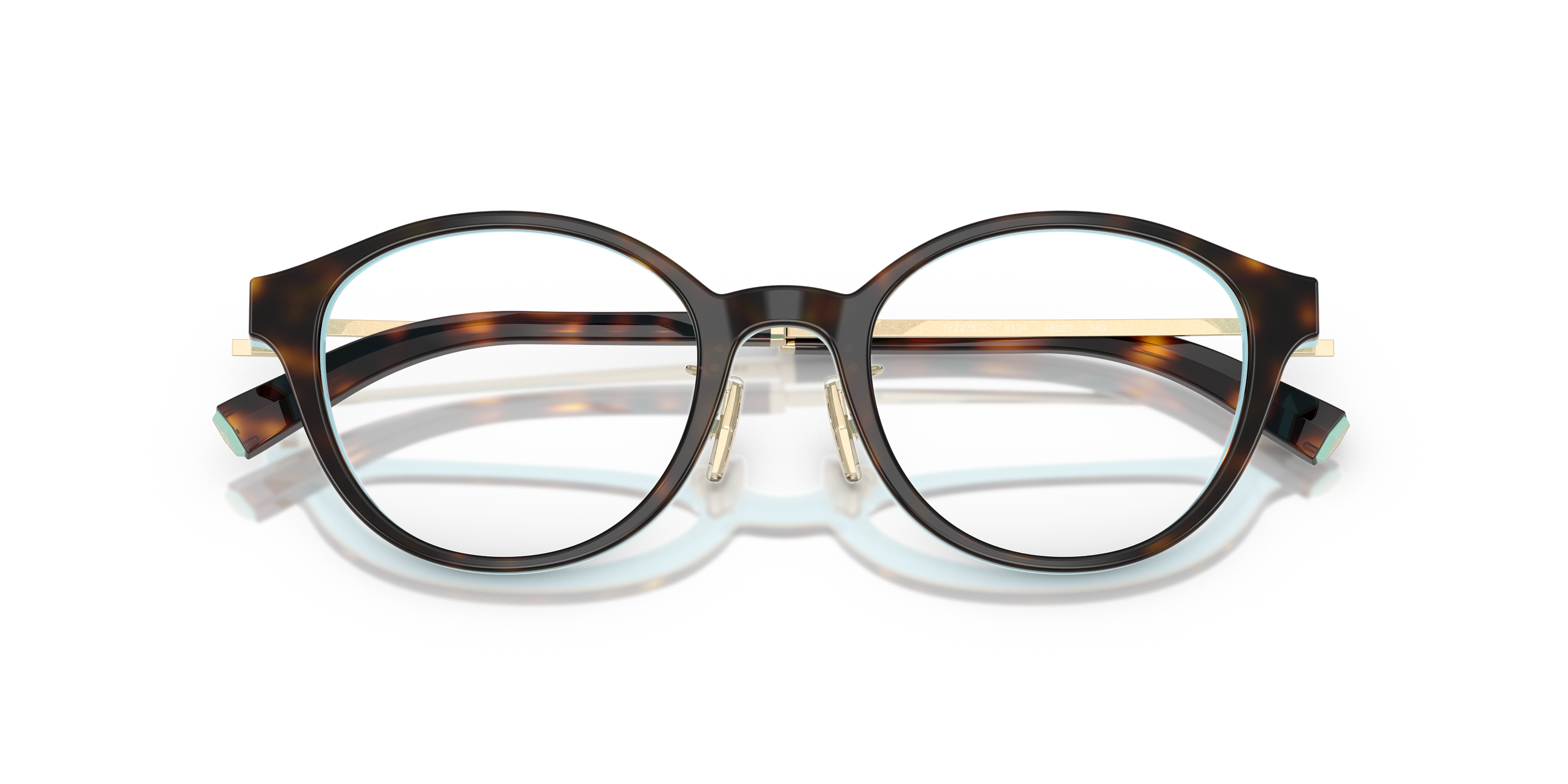 Occhiali da sole Tiffany TF2275D Havana da donna con montatura in acetato marrone tartarugato e lenti scure, mostrati su sfon