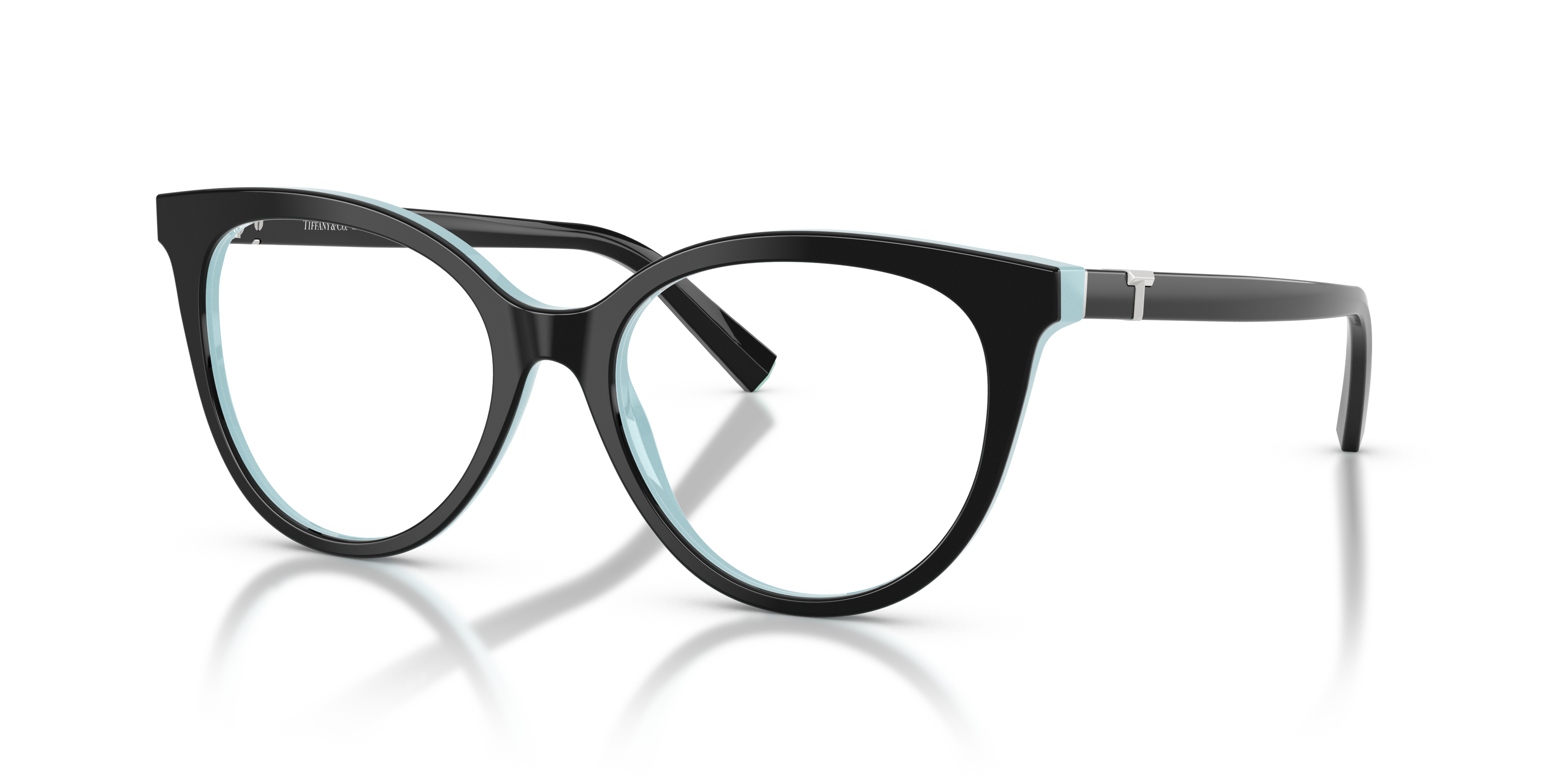 Occhiali da sole Tiffany TF2277 neri con interno aste Tiffany Blue, appoggiati su superficie chiara.