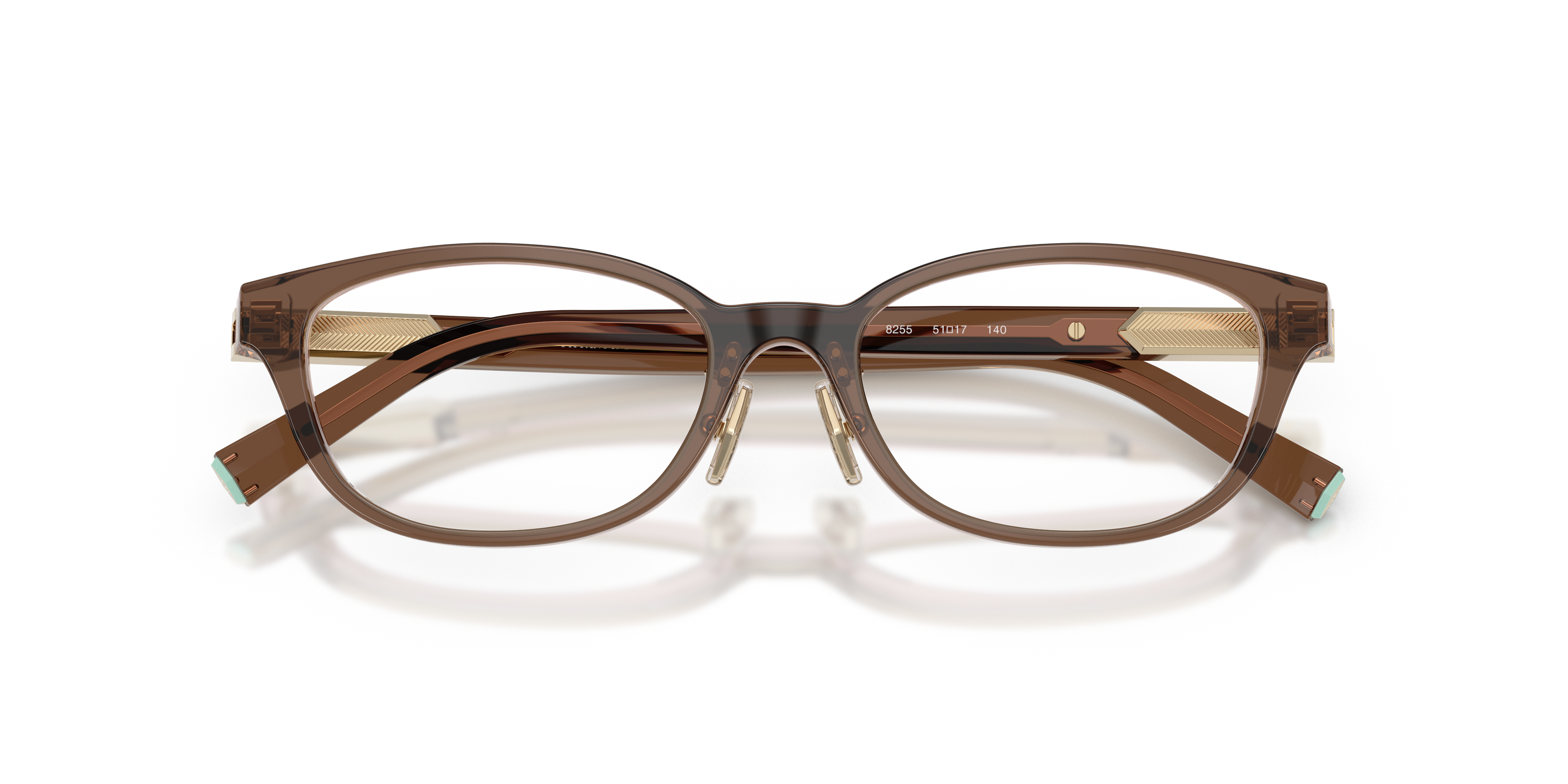 Occhiali da sole Tiffany TF2280D Spotted Brown Havana donna, con montatura in acetato e lenti scure, posti su uno sfondo chia