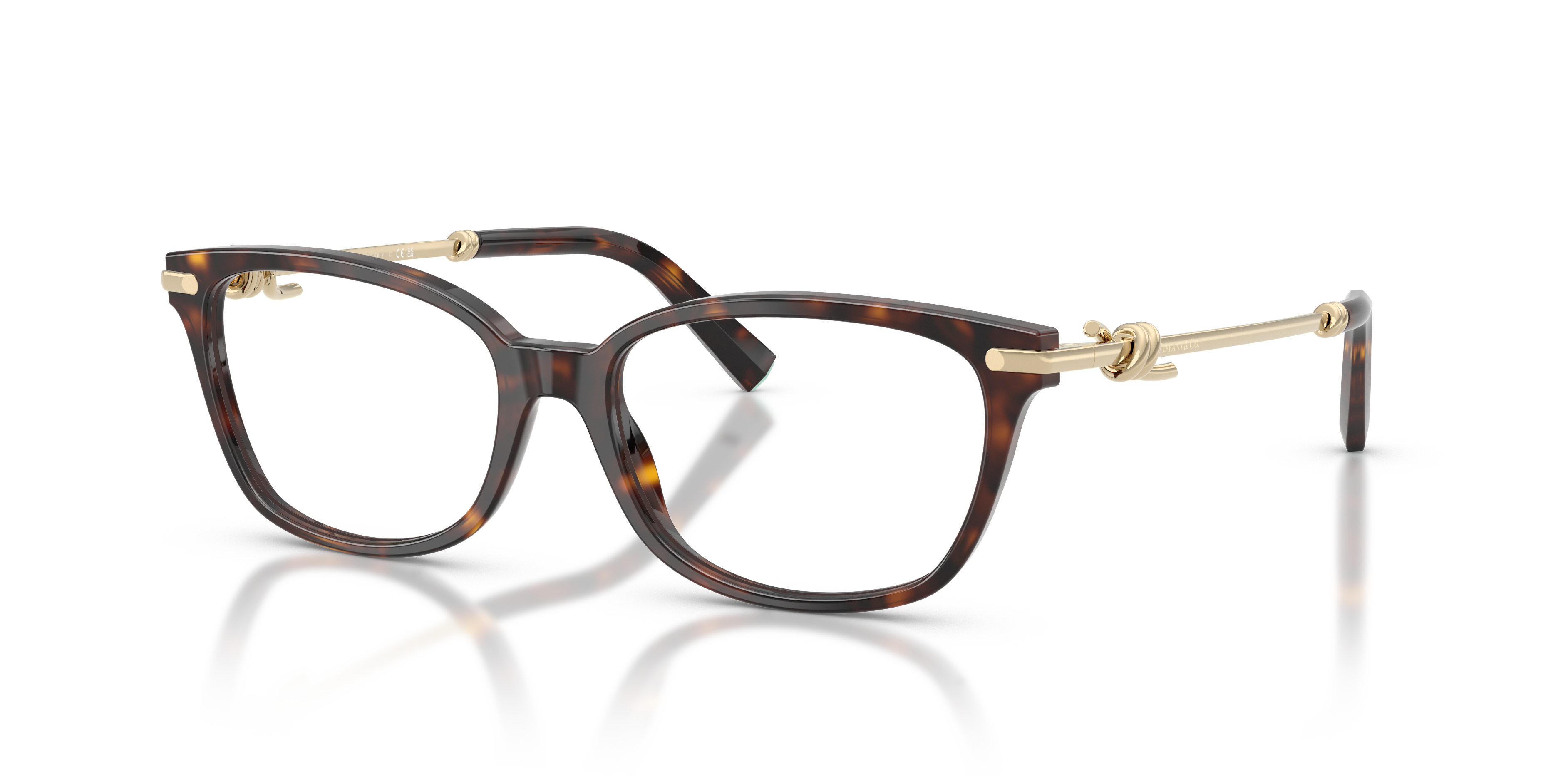 Occhiali da sole Tiffany & Co. modello TF2281 da donna, con montatura in acetato color Havana e lenti scure, posti su una sup