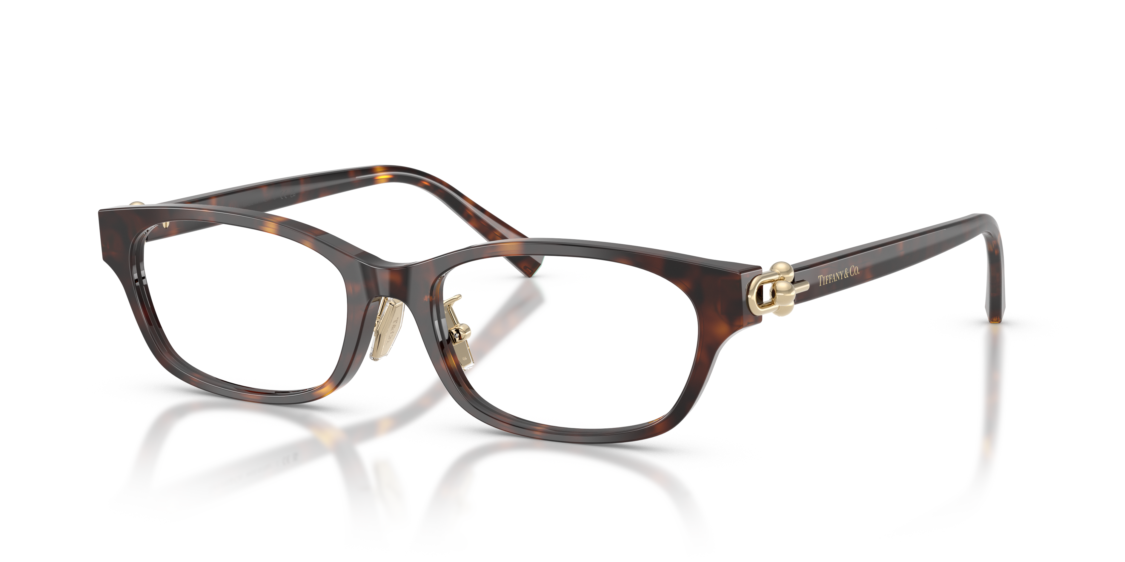 Occhiali da sole Tiffany & Co. modello TF2291D da donna in colore Havana, con montatura elegante e lenti scure, posti su una