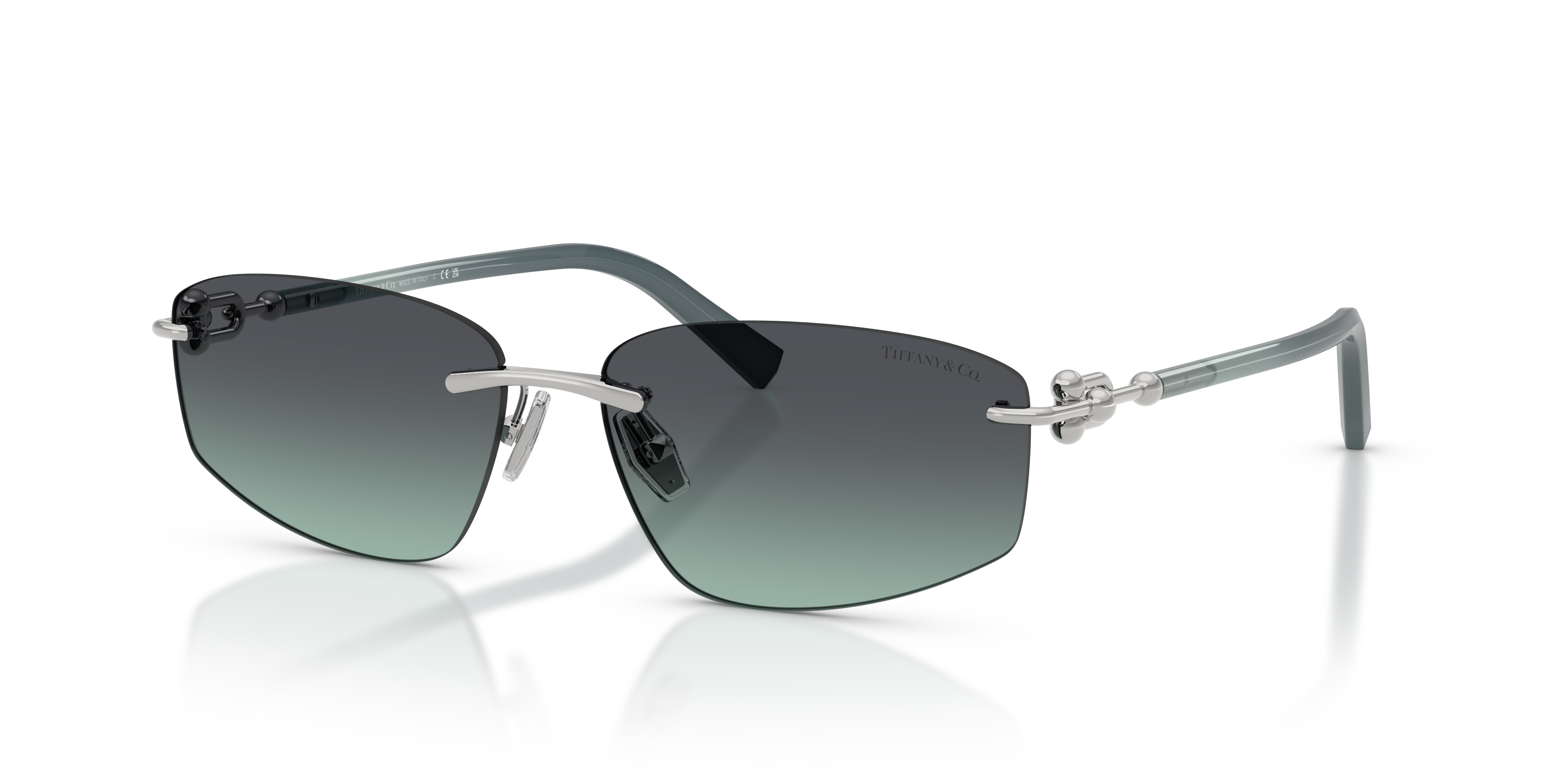 Occhiali da sole Tiffany & Co. modello TF3114 in metallo colore argento, visti frontalmente su sfondo neutro, che mostrano le