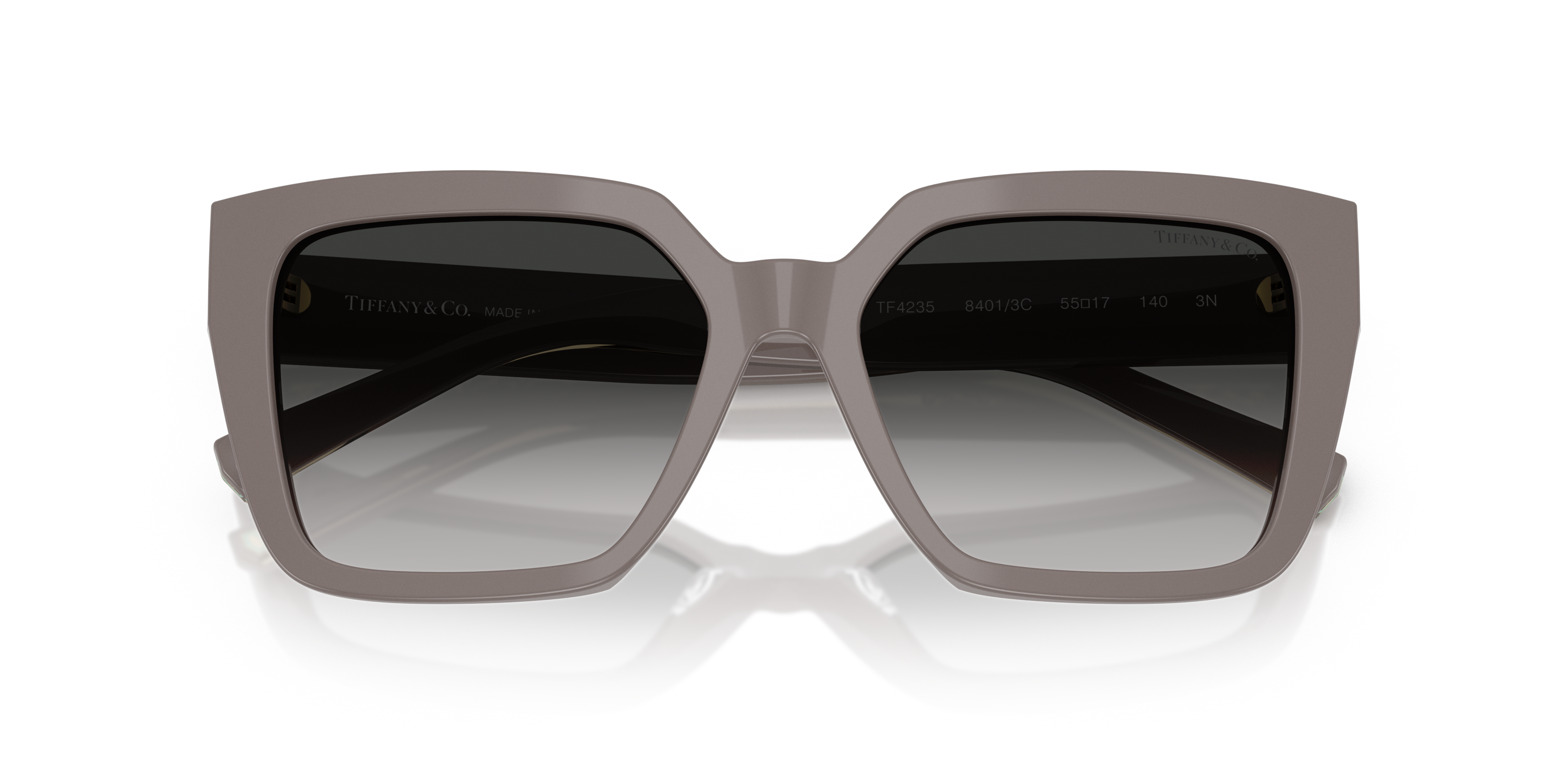 Occhiali da sole neri Tiffany & Co. modello TF4235 per donna, con montatura in acetato e logo sulle aste, appoggiati su super