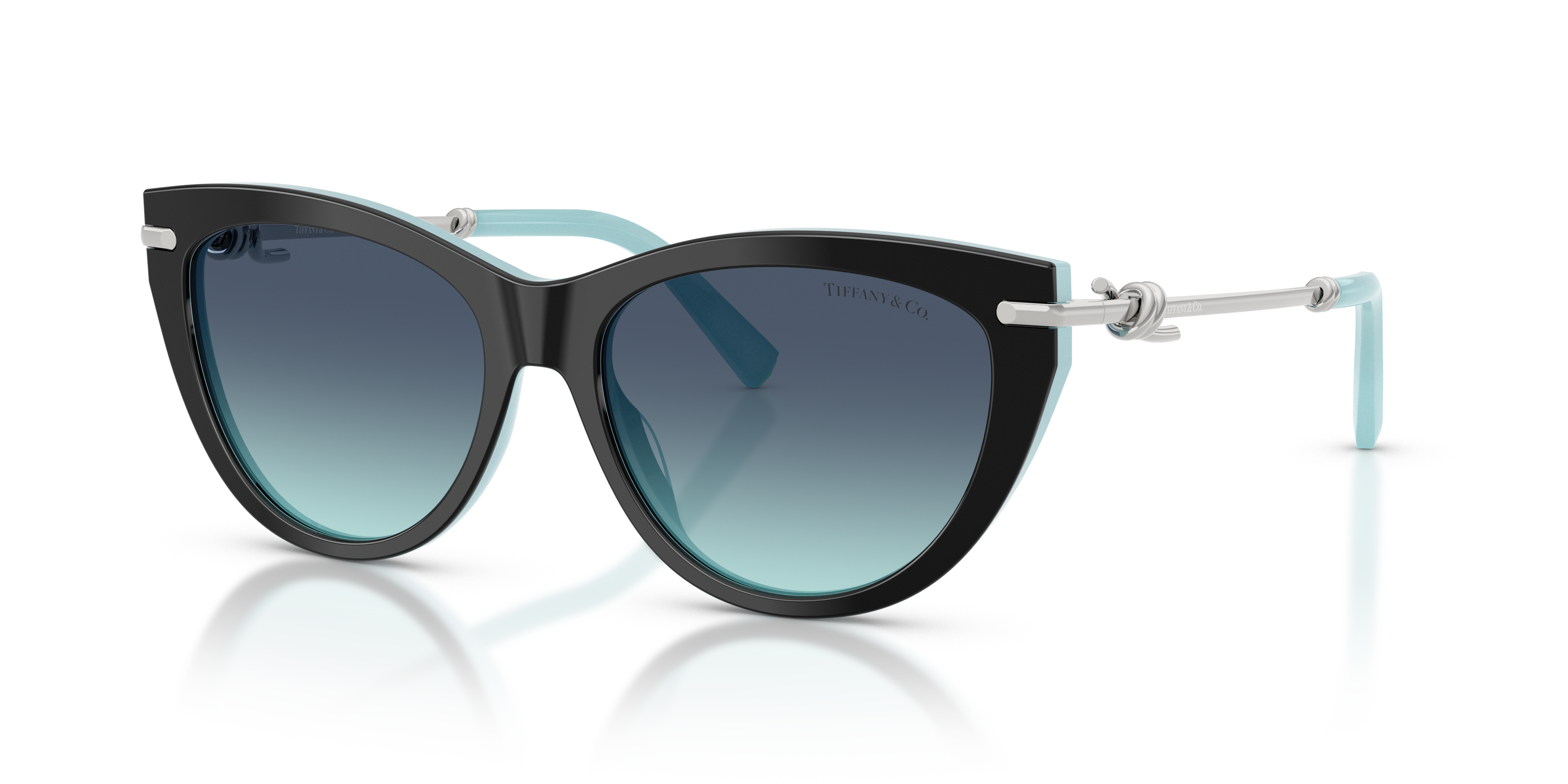 Occhiali da sole Tiffany & Co. TF4253 da donna con montatura nera e aste interne blu Tiffany, posati su una superficie bianca