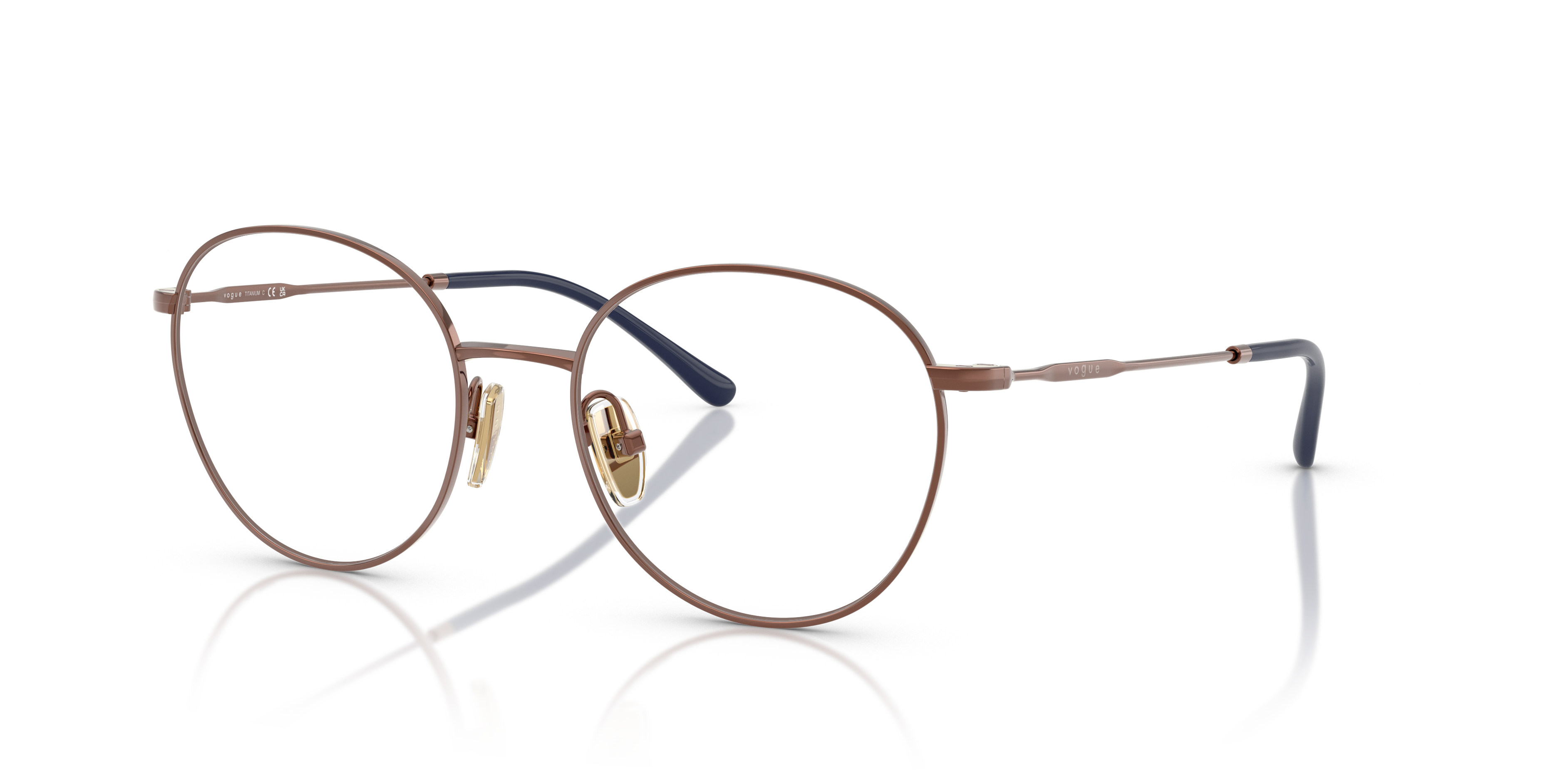 Occhiali da sole da donna Vogue Eyewear modello VO4280T di colore rame con montatura metallica e lenti scure, su sfondo neutr