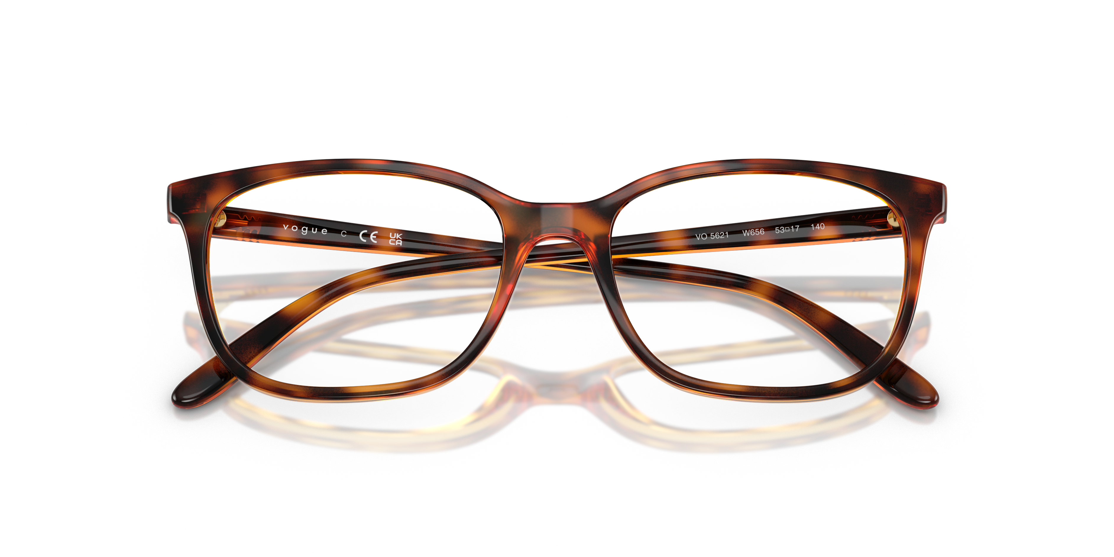 Occhiali da sole Vogue Eyewear VO5621 da donna, colore taupe, appoggiati su una superficie chiara con luce naturale.