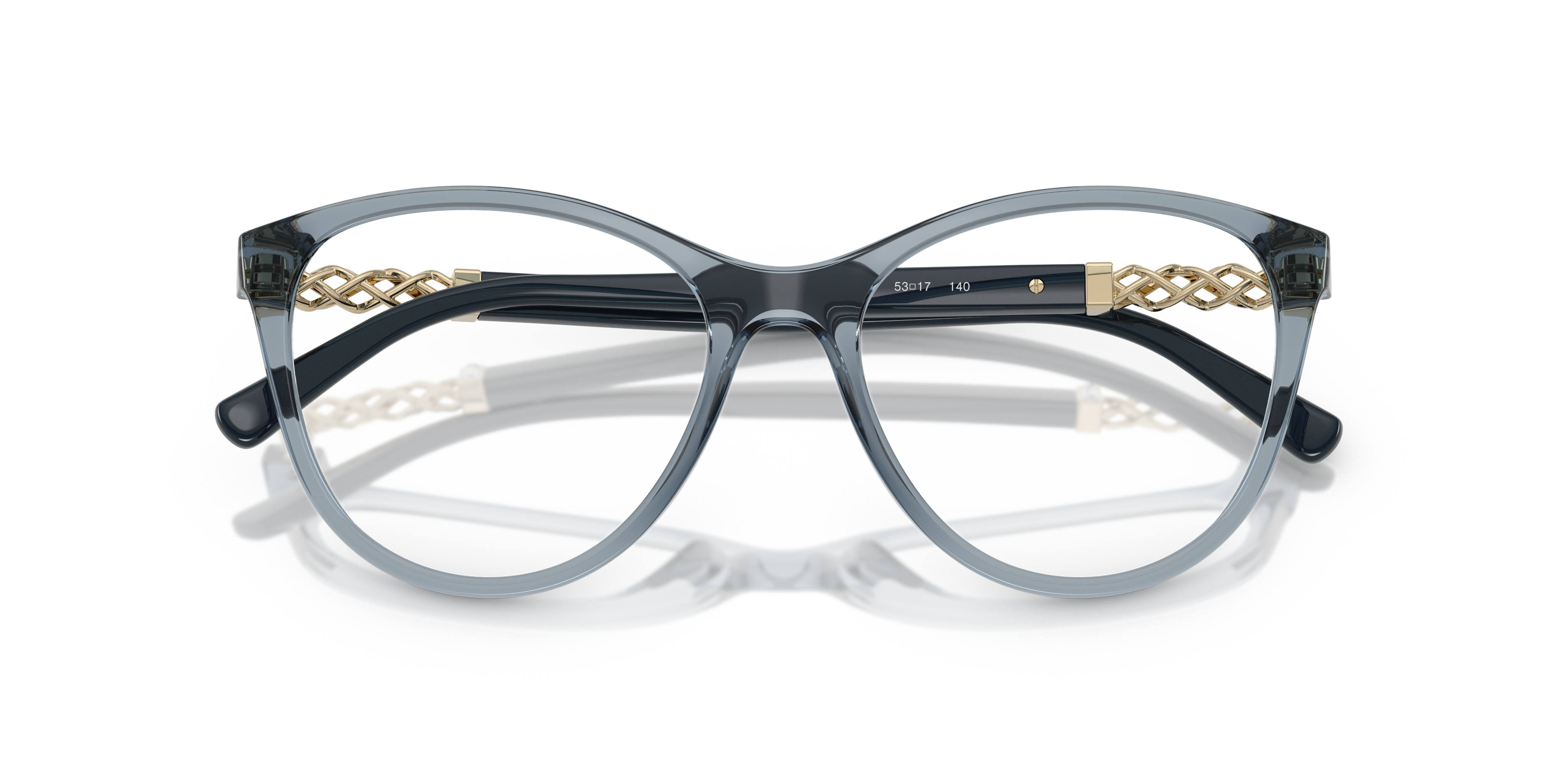 Occhiali da sole Vogue Eyewear VO5631B da donna con montatura Transparent Caramel lucida e lenti marroni, poggiati su una sup