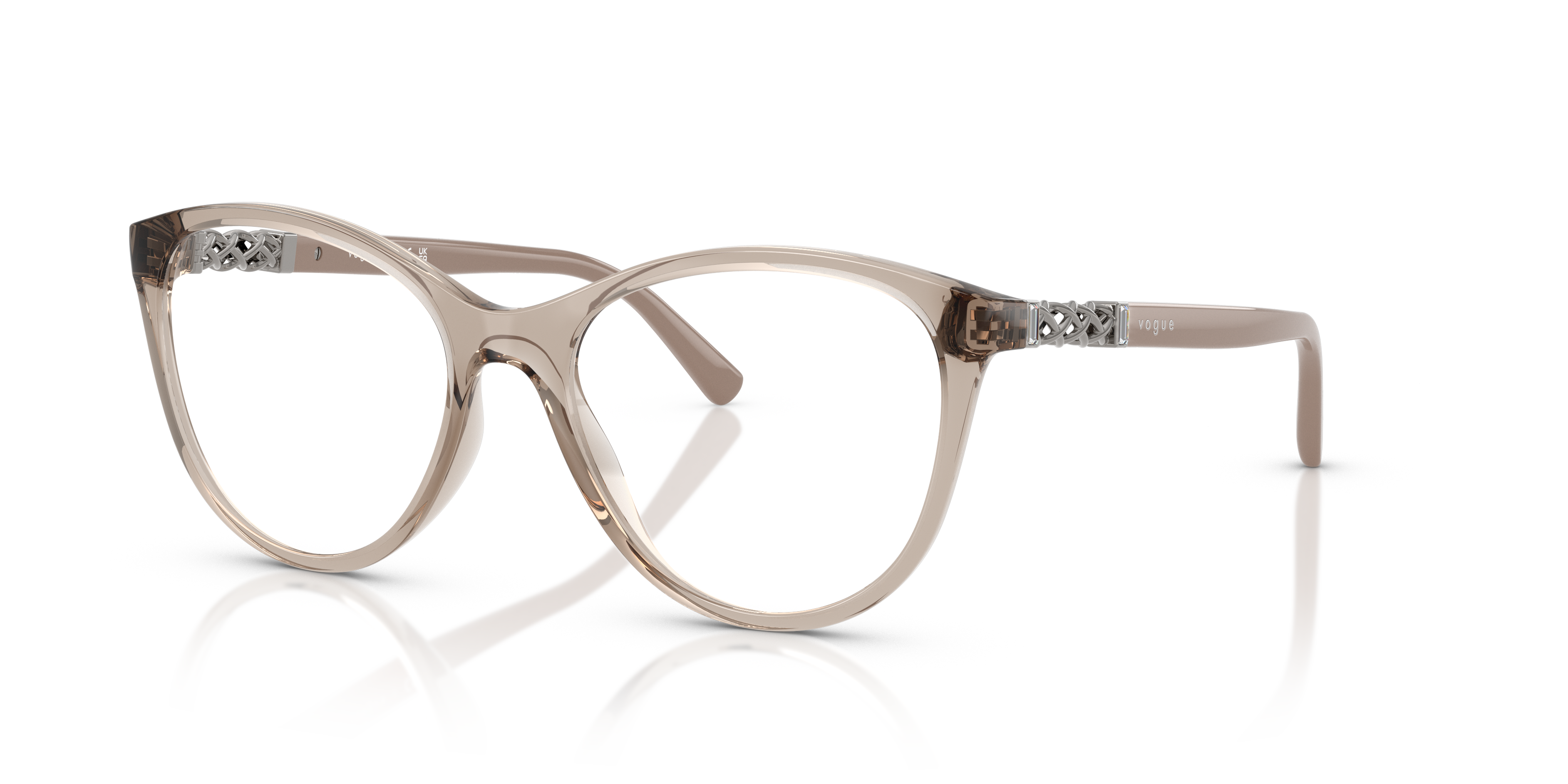 Occhiali da sole Vogue Eyewear VO5631B da donna con montatura Transparent Caramel lucida e lenti marroni, poggiati su una sup