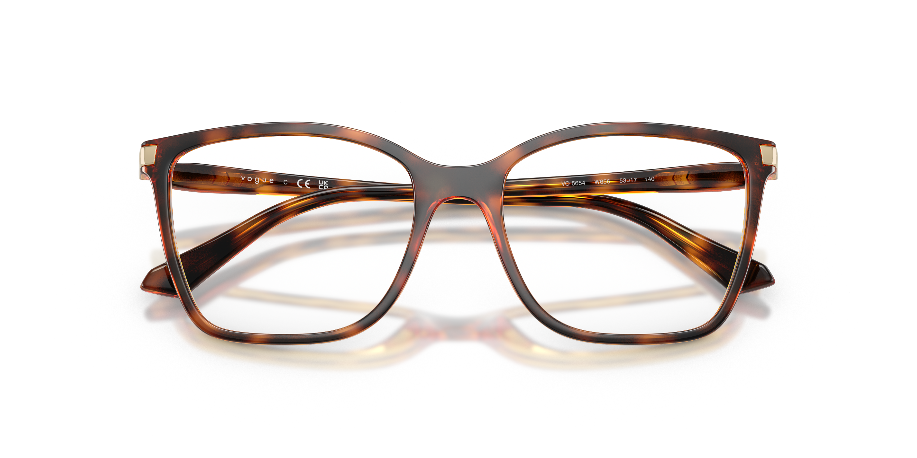 Occhiali da sole donna Vogue Eyewear modello VO5654 Full Cherry, montatura rossa a farfalla con lenti scure, indossati su un