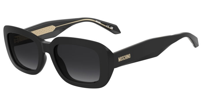 Occhiali da sole Moschino neri da donna, modello MOS199/S 208185, con montatura rettangolare e lenti scure, appoggiati su una
