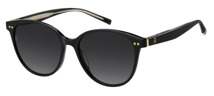Occhiali da sole donna Tommy Hilfiger TH 2289/S color avana, montatura squadrata con lenti scure, posti su una superficie chi