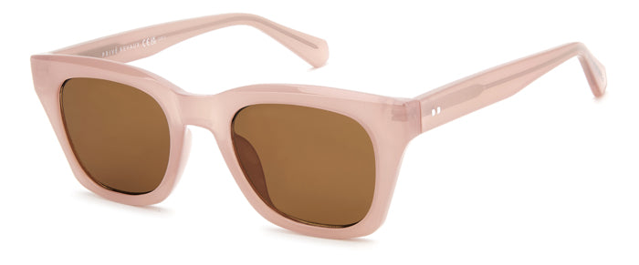 Occhiali da sole Privé Revaux modello 208928 (PR3009/G/S) da donna, montatura color avana e lenti scure, posti su una superfi